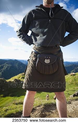 A Man Wearing A Skirt And Pouch Around His Waist, Whanganui National Park; Whakahoro, New Zealand View Large Photo Image Stock Image - A Man Wearing A Skirt And Pouch Around His Waist, Whanganui National Park; Whakahoro, New Zealand. Fotosearch