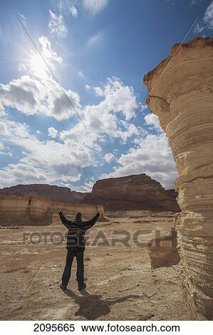 A Man With Arms Raised At Masada A Place Of Ancient Fortifications; Masada Southern District Israel View Large Photo Image Stock Photography - A Man With Arms Raised At Masada A Place Of Ancient Fortifications; Masada Southern District Israel. Fotosearch