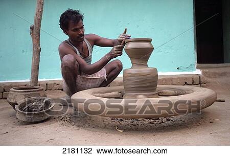A man working on a pottery wheel, Potters village; Madhya Pradesh, India View Large Photo Image Stock Image - A man working on a pottery wheel, Potters village; Madhya Pradesh, India. Fotosearch