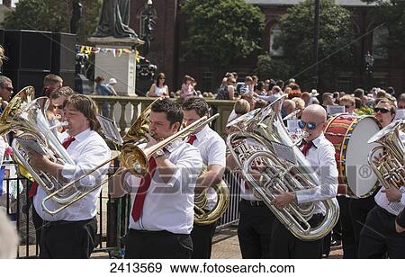 Stock Photo - A marching band performs on the street; South Shields, Tyne and Wear, England. Fotosearch