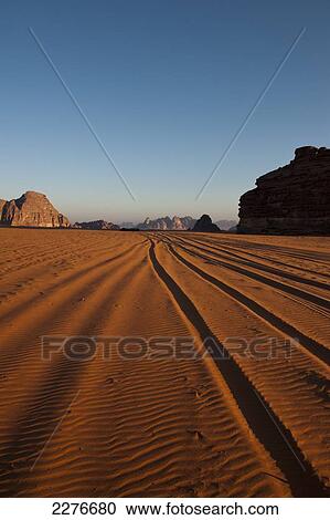 Stock Image - A maze of monolithic rockscapes rising up from the desert floor, Wadi Rum; Jordan. Fotosearch