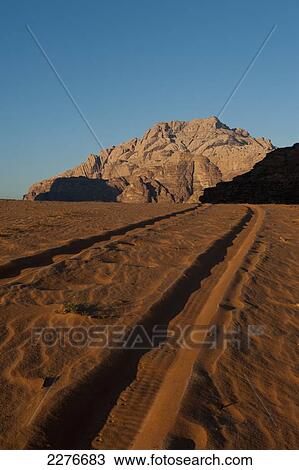 Stock Image - A maze of monolithic rockscapes rising up from the desert floor, Wadi Rum; Jordan. Fotosearch