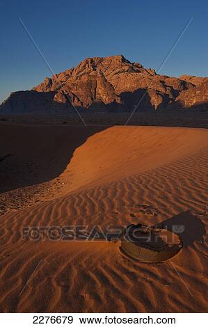 Stock Photo - A maze of monolithic rockscapes rising up from the desert floor, Wadi Rum; Jordan. Fotosearch