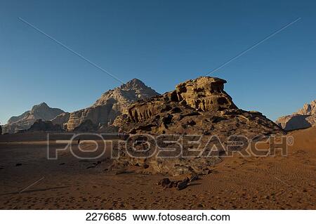 Stock Photography - A maze of monolithic rockscapes rising up from the desert floor, Wadi Rum; Jordan. Fotosearch