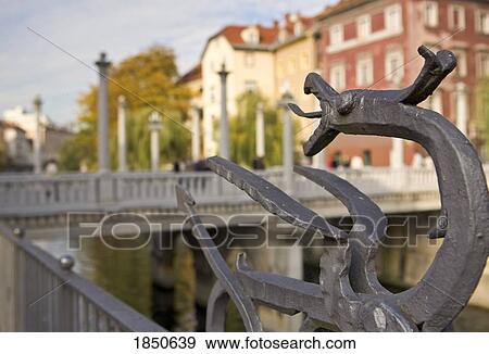 A Metal Statue On A Bridge Railing View Large Photo Image Stock Photo - A Metal Statue On A Bridge Railing. Fotosearch