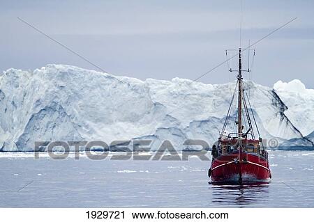 Stock Image - A Midnight Cruise Around The Ilulissat Ice Fjord, One Of Unesco World Heritage Sites. Greenland.. Fotosearch