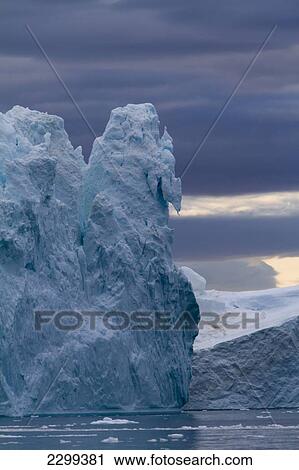 Stock Image - A Midnight Cruise Around The Ilulissat Ice Fjord, One Of Unesco World Heritage Sites. Greenland.. Fotosearch