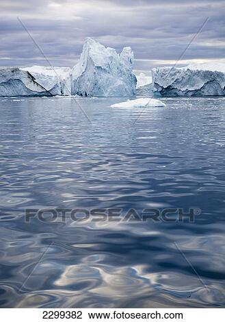 Stock Image - A Midnight Cruise Around The Ilulissat Ice Fjord, One Of Unesco World Heritage Sites. Greenland.. Fotosearch