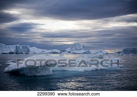 Stock Image - A Midnight Cruise Around The Ilulissat Ice Fjord, One Of Unesco World Heritage Sites. Greenland.. Fotosearch