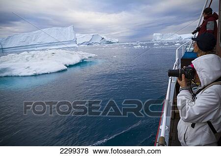 Stock Photo - A Midnight Cruise Around The Ilulissat Ice Fjord, One Of Unesco World Heritage Sites. Greenland.. Fotosearch