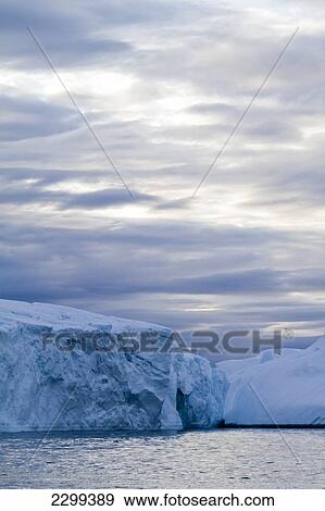 Stock Photo - A Midnight Cruise Around The Ilulissat Ice Fjord, One Of Unesco World Heritage Sites. Greenland.. Fotosearch