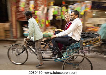 A Mixed Race Couple Riding In A Rickshaw; Ludhiana, Punjab, India View Large Photo Image Stock Image - A Mixed Race Couple Riding In A Rickshaw; Ludhiana, Punjab, India. Fotosearch