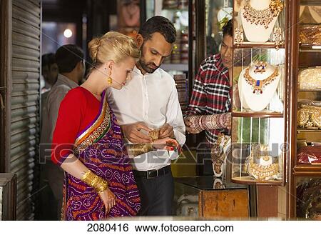 A Mixed Race Couple Shopping For Jewelry; Ludhiana, Punjab, India View Large Photo Image Stock Photograph - A Mixed Race Couple Shopping For Jewelry; Ludhiana, Punjab, India. Fotosearch