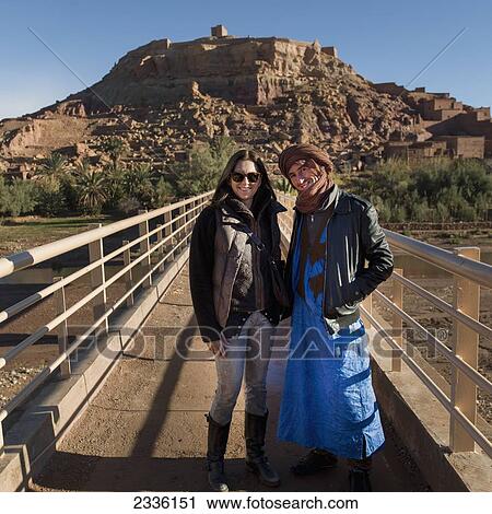 A Moroccan Man Posing With A Tourist; Ait Benhaddou, Souss-Massa-Draa, Morocco View Large Photo Image Stock Image - A Moroccan Man Posing With A Tourist; Ait Benhaddou, Souss-Massa-Draa, Morocco. Fotosearch