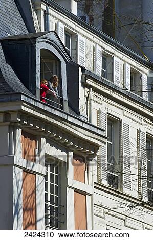 A mother and child watching from their house window; Paris, France View Large Photo Image Stock Image - A mother and child watching from their house window; Paris, France. Fotosearch