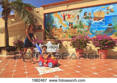 A Mother And Daughter Walking Downtown; Todos Santos Baja California Sur Mexico View Large Photo Image Stock Photo - A Mother And Daughter Walking Downtown; Todos Santos Baja California Sur Mexico. Fotosearch