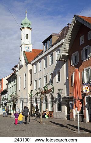 A mother holds hands with a child and walks down a street; Murnau, Bavaria, Germany View Large Photo Image Stock Image - A mother holds hands with a child and walks down a street; Murnau, Bavaria, Germany. Fotosearch
