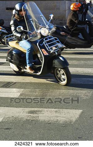 A motorcyclist on a road; Paris, France View Large Photo Image Stock Image - A motorcyclist on a road; Paris, France. Fotosearch