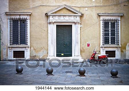 Picture - A Motorized Scooter Parked Outside A Building; Genoa Liguria Italy. Fotosearch