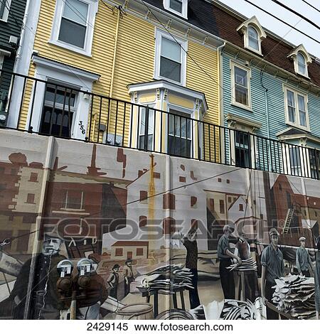 Stock Photography - A mural painted on the wall below residential buildings; St. John's, Newfoundland, Canada. Fotosearch