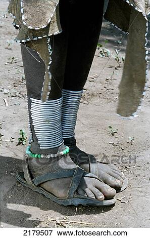 A Mursi tribal woman displaying traditional leg decorations. Makki / South Omo / Southern Nations, Nationalities & People's Region (Ethiopia). View Large Photo Image Stock Photo - A Mursi tribal woman displaying traditional leg decorations. Makki / South Omo / Southern Nations, Nationalities & People's Region (Ethiopia).. Fotosearch