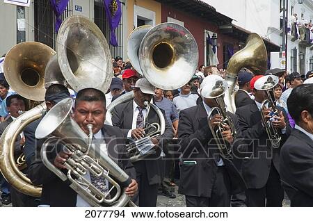 A Music Band Plays Funeral Marches During The Procession Of The Holy Cross On Good Friday In Antigua Guatemala, Sacatep View Large Photo Image Picture - A Music Band Plays Funeral Marches During The Procession Of The Holy Cross On Good Friday In Antigua Guatemala, Sacatep. Fotosearch
