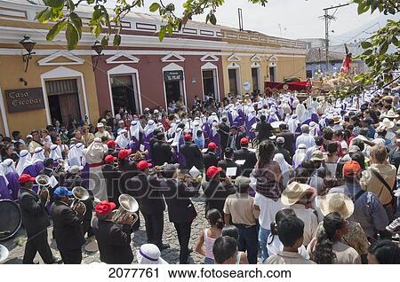 Stock Image - A Music Band Plays Funeral Marches During The Procession Of The Holy Cross On Good Friday In Antigua Guatemala, Sacatep. Fotosearch