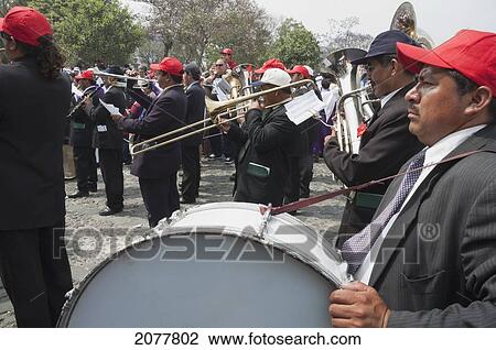 A Music Band Plays Funeral Marches During The Procession Of The Holy Cross On Good Friday In Antigua Guatemala, Sacatep View Large Photo Image Stock Image - A Music Band Plays Funeral Marches During The Procession Of The Holy Cross On Good Friday In Antigua Guatemala, Sacatep. Fotosearch