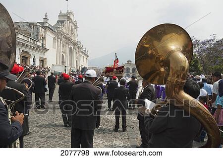 A Music Band Plays Funeral Marches During The Procession Of The Holy Cross On Good Friday In Antigua Guatemala, Sacatep View Large Photo Image Stock Photo - A Music Band Plays Funeral Marches During The Procession Of The Holy Cross On Good Friday In Antigua Guatemala, Sacatep. Fotosearch