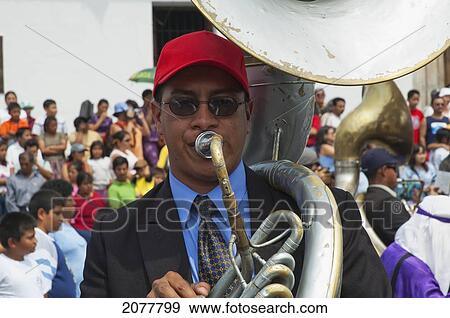 Stock Photo - A Music Band Plays Funeral Marches During The Procession Of The Holy Cross On Good Friday In Antigua Guatemala, Sacatep. Fotosearch