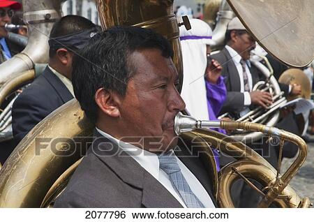 Stock Photograph - A Music Band Plays Funeral Marches During The Procession Of The Holy Cross On Good Friday In Antigua Guatemala, Sacatep. Fotosearch