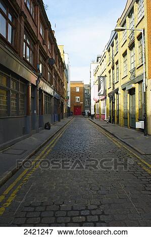A narrow street of setts, Shoreditch; London, England View Large Photo Image Stock Photo - A narrow street of setts, Shoreditch; London, England. Fotosearch