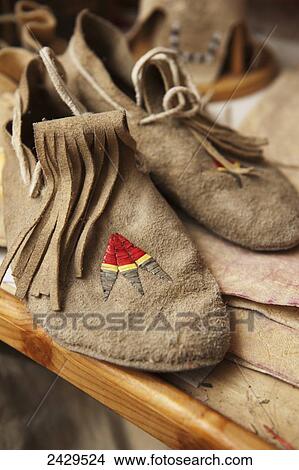 A pair of traditional Native American shoes; Rossburn, Manitoba, Canada View Large Photo Image Picture - A pair of traditional Native American shoes; Rossburn, Manitoba, Canada. Fotosearch