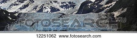 Stock Image - A panoramic view of Surprise Glacier; Alaska, United States of America. Fotosearch