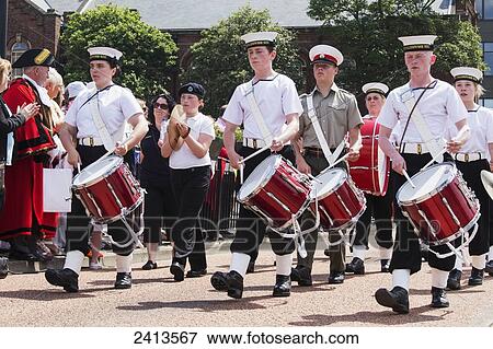 A percussion marching band walking down the street; South Shields, Tyne and Wear, England View Large Photo Image Stock Photo - A percussion marching band walking down the street; South Shields, Tyne and Wear, England. Fotosearch