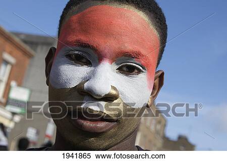 A Person With Face Painted For The Saint Patrick's Day Parade; Dublin Ireland View Large Photo Image Stock Photography - A Person With Face Painted For The Saint Patrick's Day Parade; Dublin Ireland. Fotosearch