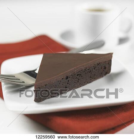 A piece of chocolate cake on a plate View Large Photo Image Stock Image - A piece of chocolate cake on a plate. Fotosearch