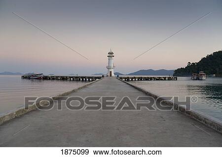 A Pier Leading Out To A Lighthouse; Bang Bao, Koh Chang, Thailand View Large Photo Image Stock Photo - A Pier Leading Out To A Lighthouse; Bang Bao, Koh Chang, Thailand. Fotosearch
