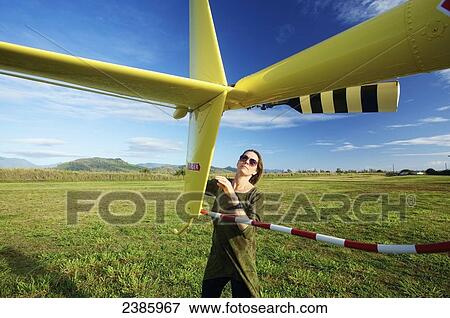 A pilot prepares a helicopter for flight; Kilauea, Hawaii, United States of America View Large Photo Image Stock Photo - A pilot prepares a helicopter for flight; Kilauea, Hawaii, United States of America. Fotosearch