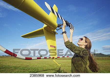 A pilot prepares a helicopter for flight; Kilauea, Hawaii, United States of America View Large Photo Image Stock Photo - A pilot prepares a helicopter for flight; Kilauea, Hawaii, United States of America. Fotosearch
