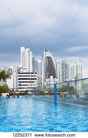 Stock Image - A poolside view overlooking the newer side of the Panama City skyline; Panama City, Panama. Fotosearch