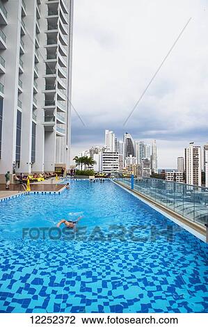 Stock Image - A poolside view overlooking the newer side of the Panama City skyline; Panama City, Panama. Fotosearch