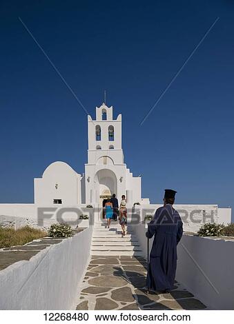 A priest arriving at the Chrysopiyi Monastery; Sifnos, Cyclades, Greek Islands, Greece View Large Photo Image Stock Image - A priest arriving at the Chrysopiyi Monastery; Sifnos, Cyclades, Greek Islands, Greece. Fotosearch