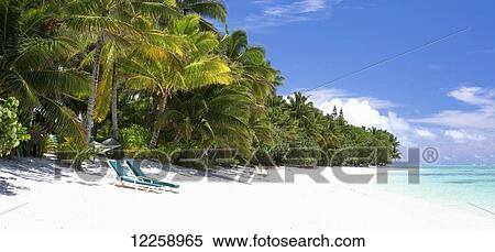 Stock Photography - A pristine beach with two beach chairs; Rarotonga, Cook Islands. Fotosearch