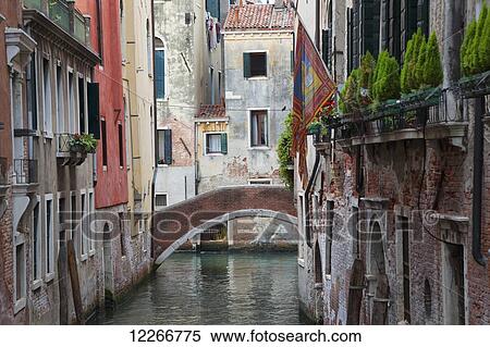 Stock Photography - A quaint bridge over a narrow canal; Venice, Italy. Fotosearch
