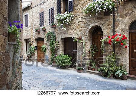 A quaint village with flowers decorating residential buildings; Pienza, Tuscany, Italy View Large Photo Image Stock Photo - A quaint village with flowers decorating residential buildings; Pienza, Tuscany, Italy. Fotosearch
