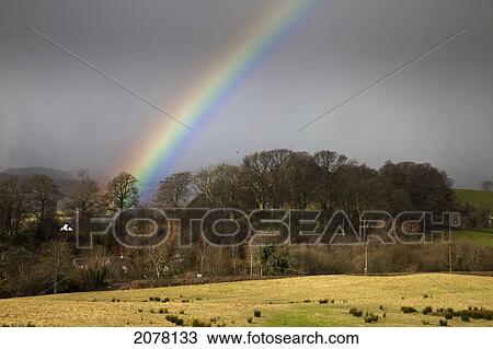 A Rainbow Against Storm Clouds; Dumfries Scotland View Large Photo Image Stock Image - A Rainbow Against Storm Clouds; Dumfries Scotland. Fotosearch