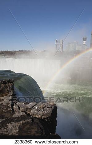 A Rainbow Over Niagara Falls And Gorge With Mist And Blue Sky; Niagara Falls, New York, United States Of America View Large Photo Image Stock Image - A Rainbow Over Niagara Falls And Gorge With Mist And Blue Sky; Niagara Falls, New York, United States Of America. Fotosearch