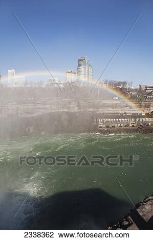 A Rainbow Over Niagara Falls And Gorge With Mist And Blue Sky; Niagara Falls, New York, United States Of America View Large Photo Image Stock Image - A Rainbow Over Niagara Falls And Gorge With Mist And Blue Sky; Niagara Falls, New York, United States Of America. Fotosearch