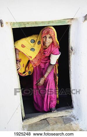 Stock Photo - A Rajput Woman Leaving A Building Near Jaisalmer, Rajasthan, India. Fotosearch